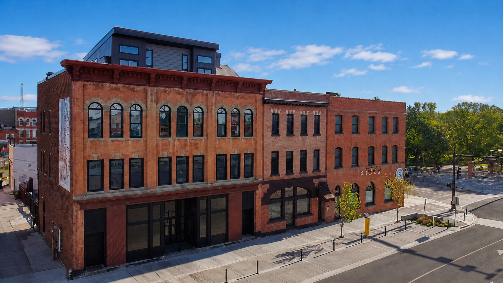 The Whitney Block restored 1907 brick building, summer aerial view